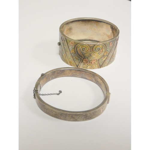 69 - Victorian silver bangle with tri colour gold wire floral inlay panels, and another. 53g.