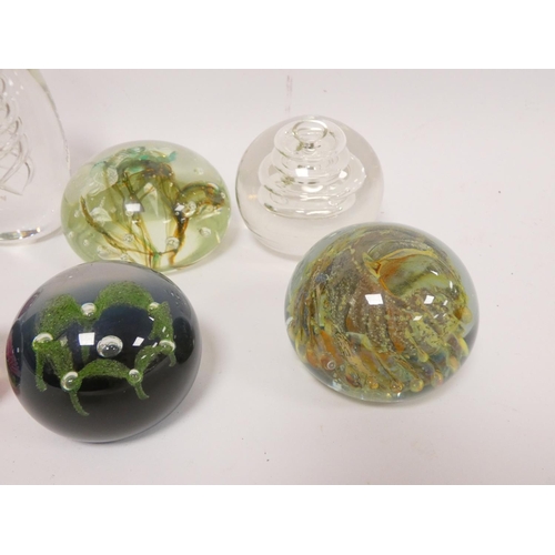 295 - Group of art glass paperweights to include a pear shaped example with helical air twist centre, bubb... 