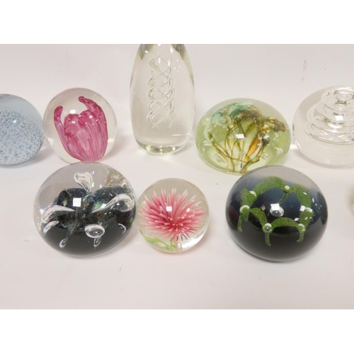 295 - Group of art glass paperweights to include a pear shaped example with helical air twist centre, bubb... 