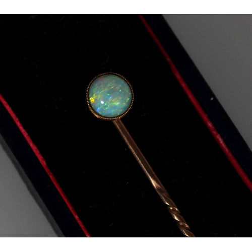 421 - Yellow metal and opal stick pin, one other base metal stick pin and a base metal chain.