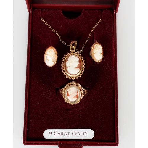 423 - 9ct gold and shell cameo evening set consisting of pendant on necklace, earrings and a ring.