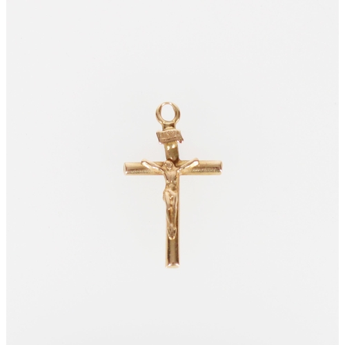 429 - Yellow metal crucifix pendant.