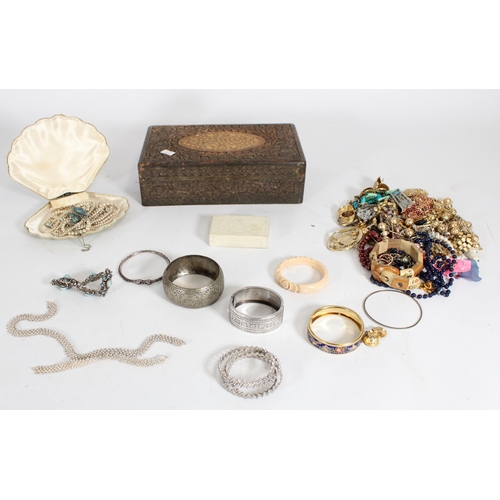 459 - Indian white metal and other jewellery held in a carved Indian hardwood table box.