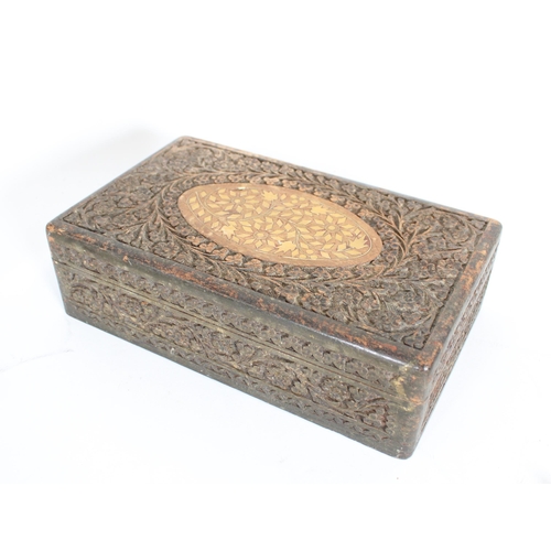 459 - Indian white metal and other jewellery held in a carved Indian hardwood table box.