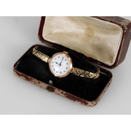 462 - 9ct gold ladies wristwatch head on plated strap.