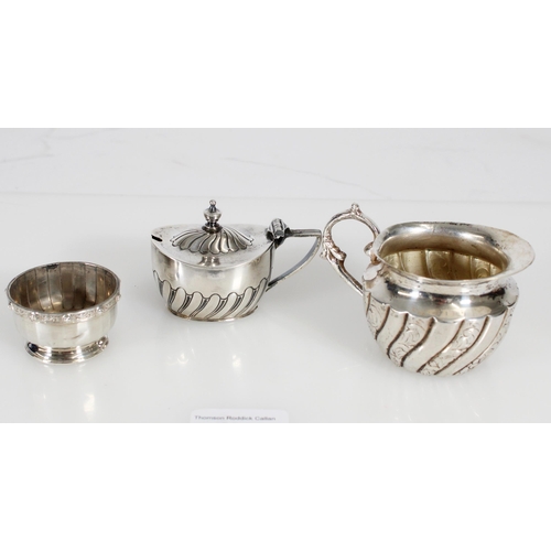 490 - Silver mustard pot and a silver salt, gross 84g, together with a white metal cream jug.