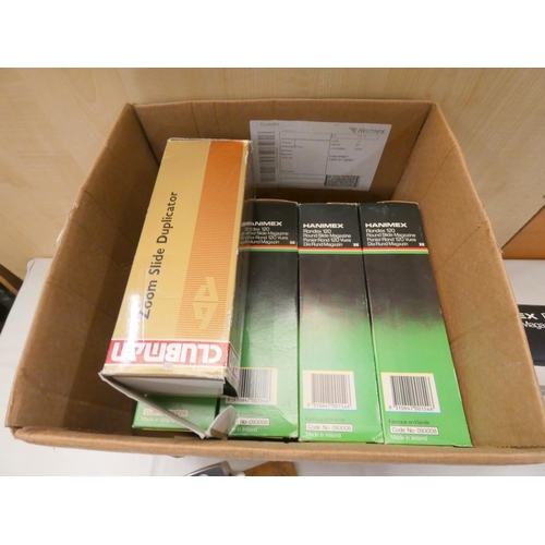 124 - Box of slide projector magazines.