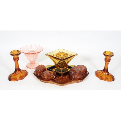 14 - Czechoslovakian amber glass to include a dressing table set, etc.