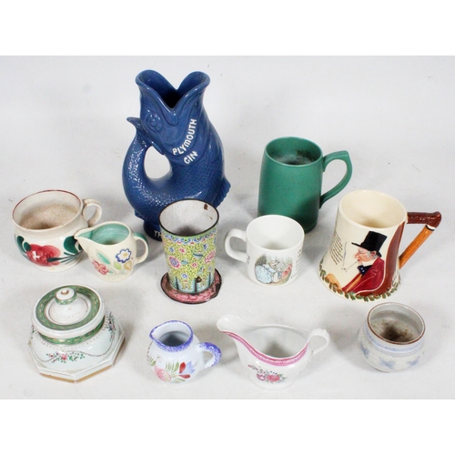 42 - Glug jug, a French porcelain inkwell, a Keith Murray for Wedgwood mug, and a Chinese Canton cloisonn... 