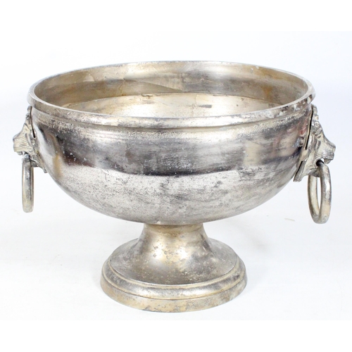 53 - Cast aluminium pedestal bowl with lion mask handles, 31cm high.