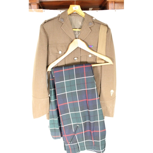 55 - King's Own Scottish Borderers No.2 dress jacket and a pair of tartan trews.