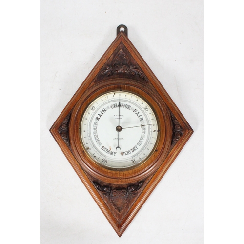 68 - Lozenge shaped wooden carved barometer.