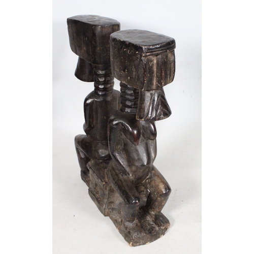 86 - Carved African hardwood caryatid stool.