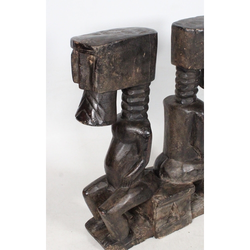 86 - Carved African hardwood caryatid stool.