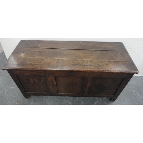421 - 19th century oak coffer with hinged top enclosing a pine candle box, three-panel front, iron lock, o... 