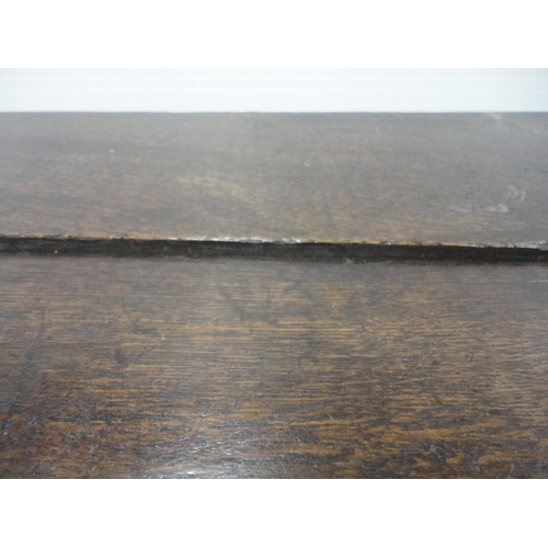 421 - 19th century oak coffer with hinged top enclosing a pine candle box, three-panel front, iron lock, o... 