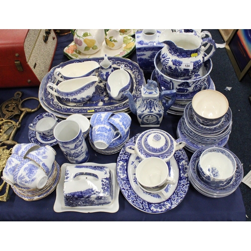 124 - Blue and white, mainly Willow pattern, ceramics to include jugs, bowls, plates, etc.