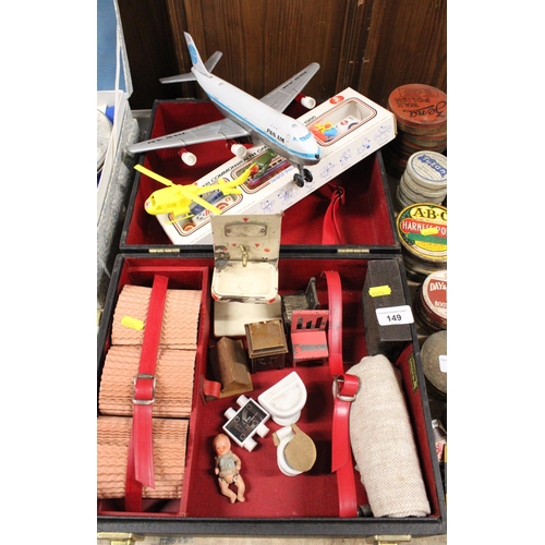 149 - Part picnic set, a battery operated model of a Pan-Am aeroplane, vintage doll's house furniture, etc... 