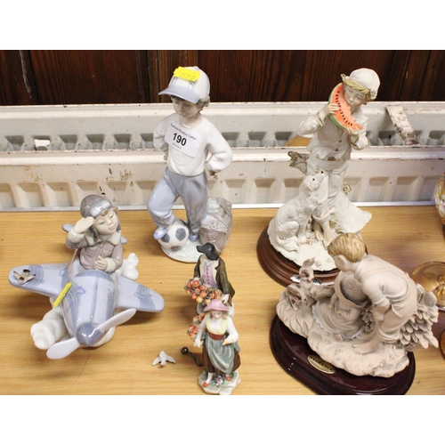 190 - Lladro model of a boy with football, another with a boy and aeroplane, a pair of continental porcela... 