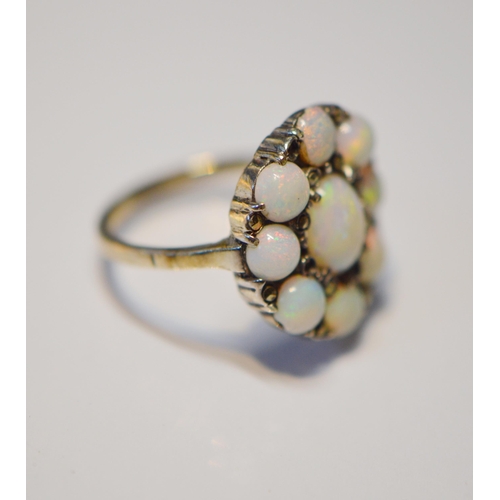 175 - Opal and marcasite oval cluster ring in silver, size L.