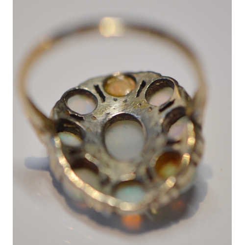 175 - Opal and marcasite oval cluster ring in silver, size L.