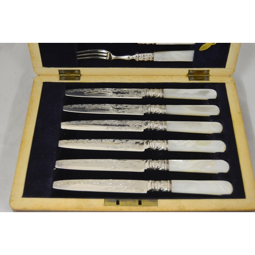 123 - Set of six EP fruit knives and forks with mother of pearl handles, engraved to the blades, in fitted... 