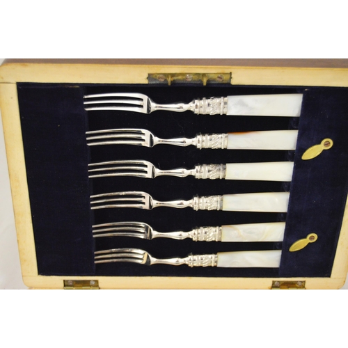 123 - Set of six EP fruit knives and forks with mother of pearl handles, engraved to the blades, in fitted... 