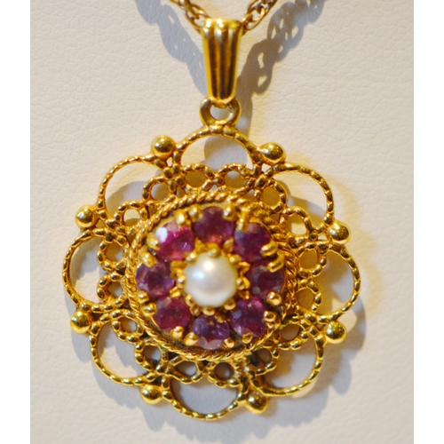 202 - 9ct gold lady's gemstone and pearl flowerhead pendant set with eight ruby-coloured stones and a cult... 