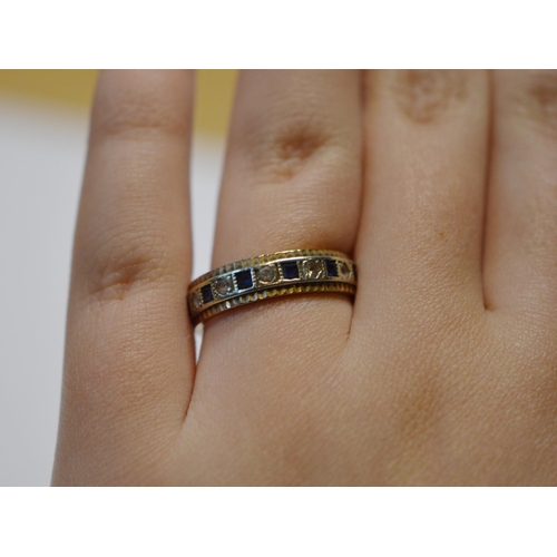 210 - 9ct white and yellow gold eternity ring, size Q, 3.7g gross.