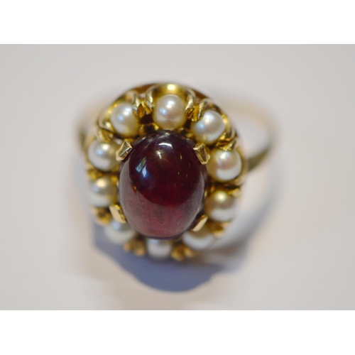 211 - Garnet and pearl cluster ring and another, three-stone ring, both 9ct gold, size P and R, 8.4g gross... 