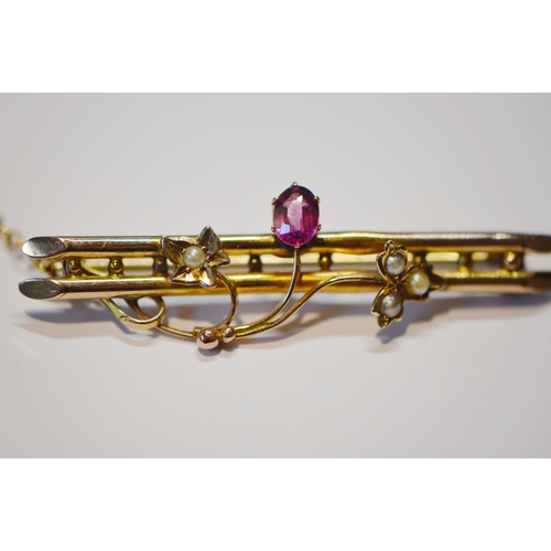 230 - Edwardian gold brooch set with seed pearl and pink tourmaline, '9c', with safety chain, 2.6g gross.