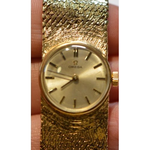 295 - Omega 9ct gold lady's bracelet watch, c. 1960, 39.5g gross.