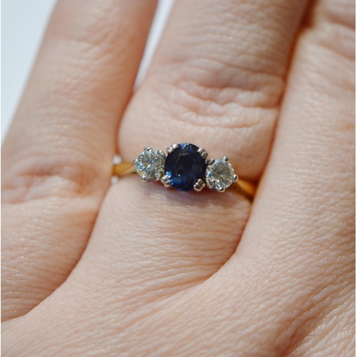 233 - Diamond and sapphire three-stone ring, the brilliants approximately .2ct, .4ct in total, 18ct gold a... 