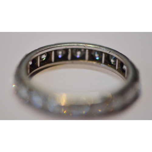 234 - Diamond full eternity ring set with eighteen brilliants, approximately .75ct in total, in platinum, ... 