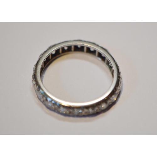 234 - Diamond full eternity ring set with eighteen brilliants, approximately .75ct in total, in platinum, ... 