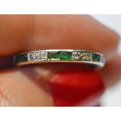 236 - Diamond full eternity ring set with diamonds and emeralds in pairs, white gold, size M, 2.9g gross.