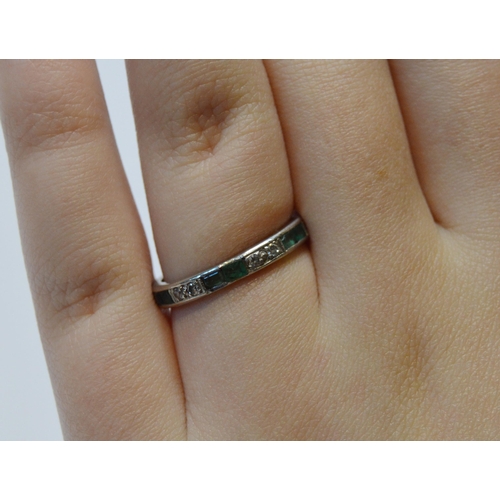 236 - Diamond full eternity ring set with diamonds and emeralds in pairs, white gold, size M, 2.9g gross.