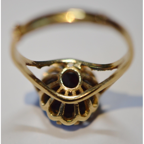 239 - Garnet ring in 9ct gold, size M with spring, 2.8g gross.