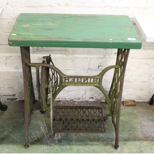 518 - Wrought iron Singer sewing machine base with green painted wooden top.