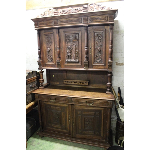 543 - Large carved two section sideboard with three carved cupboard doors flanked with fluted columns and ... 