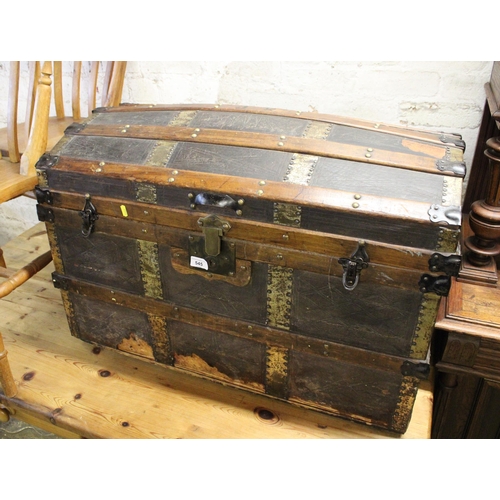 545 - Brass and wood bound domed top trunk.