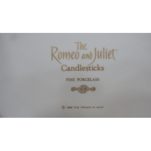 104 - Pair of Franklin Mint fine porcelain candlesticks modelled as Romeo and Juliet on oval bases.  ... 