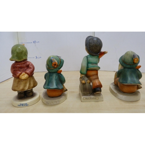 105 - Collection of Goebel Hummel figures, two Hummel table lamps, and a mother and child group.