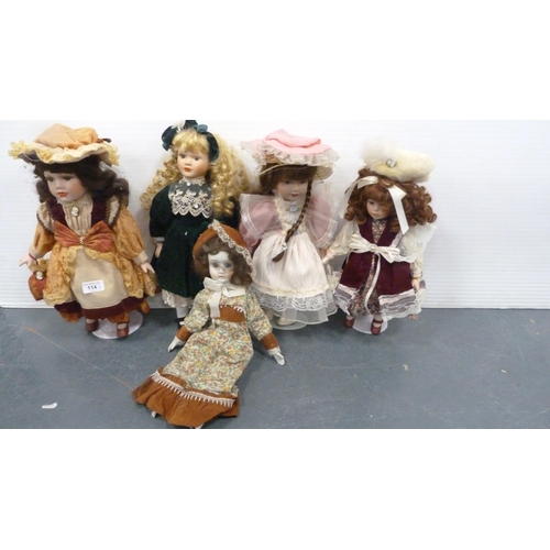 114 - Five porcelain-headed dolls, all with clothing.  (5)