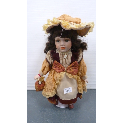 114 - Five porcelain-headed dolls, all with clothing.  (5)