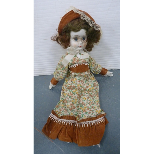 114 - Five porcelain-headed dolls, all with clothing.  (5)