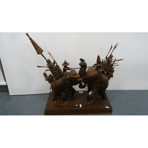 116 - Hardwood elephant group with figures carrying noblemen.