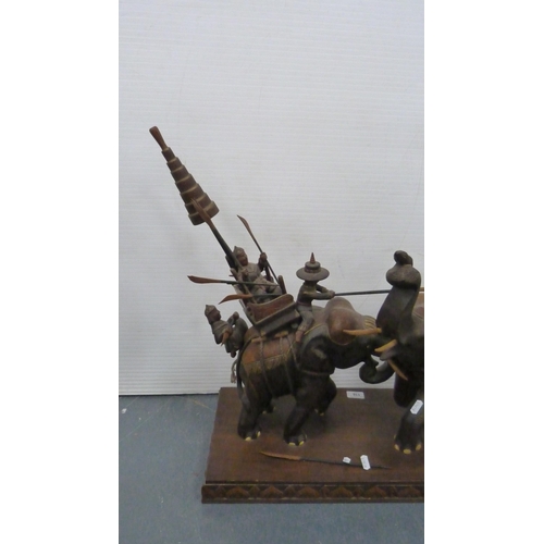 116 - Hardwood elephant group with figures carrying noblemen.