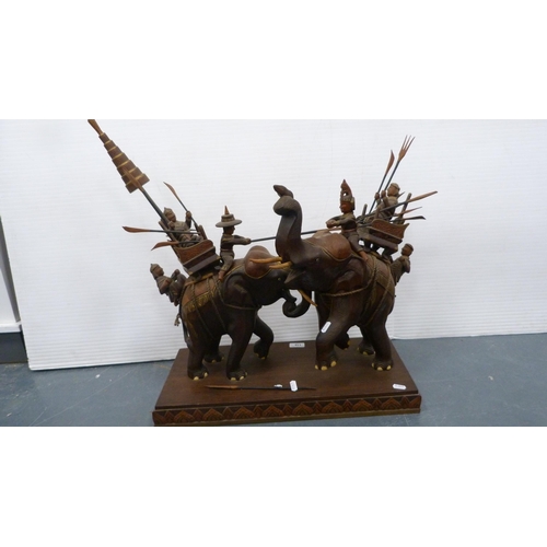 116 - Hardwood elephant group with figures carrying noblemen.