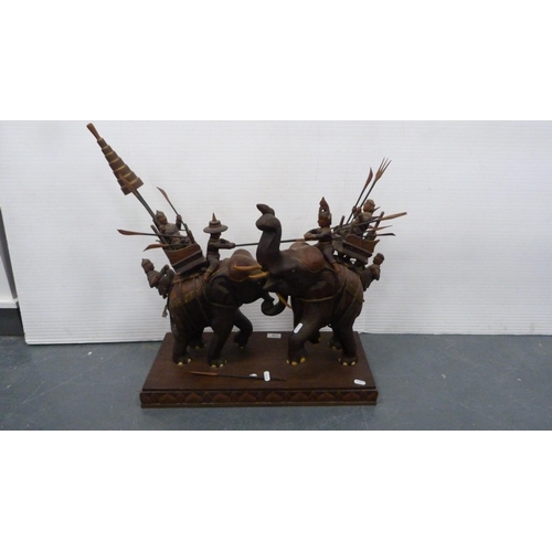 116 - Hardwood elephant group with figures carrying noblemen.